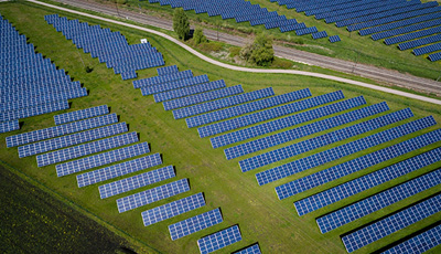 Aerial view of solar panels in vast land, UConn Applied and Resource Economics